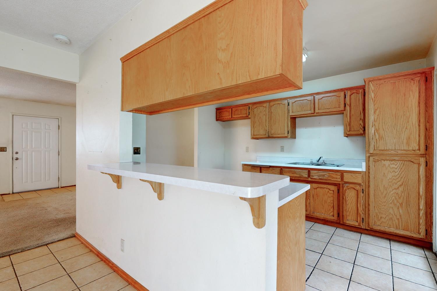 2065 Howlett Avenue Yuba City, CA 95993 - Photo 52 of 52 a kitchen with stainless steel appliances a sink and a refrigerator