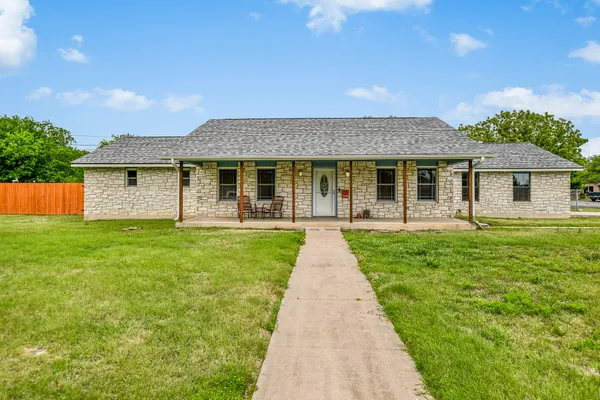 a front view of a house with yard