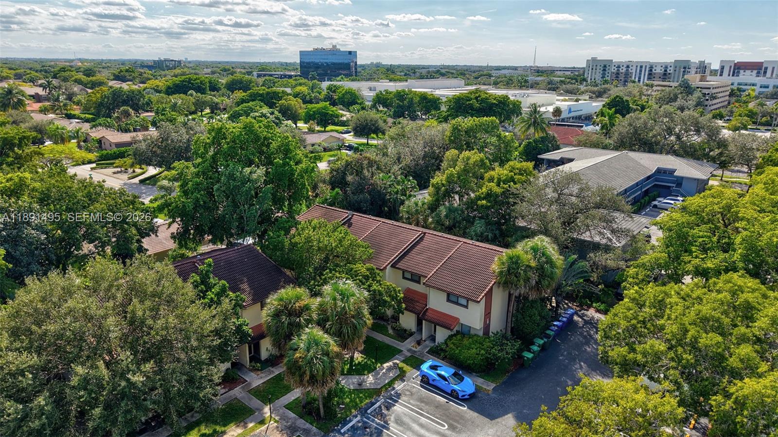 8958 West Sample Road, Unit 8958 Coral Springs, FL 33065 - Photo 22 of 37 an aerial view of a house with a yard and lake view