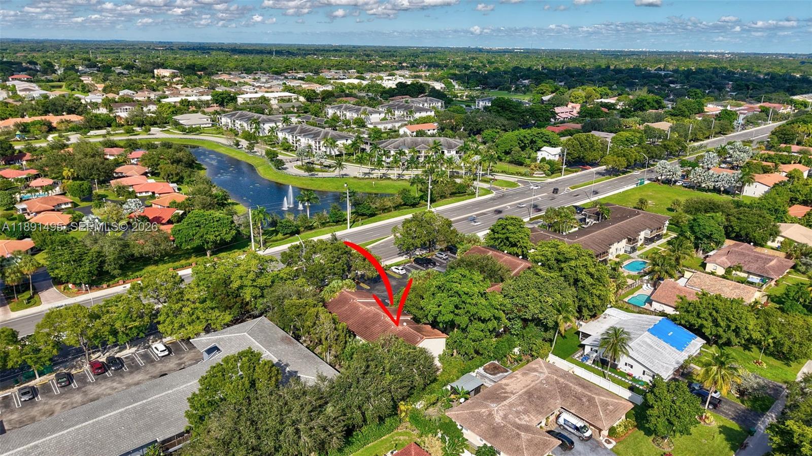 8958 West Sample Road, Unit 8958 Coral Springs, FL 33065 - Photo 34 of 37 an aerial view of residential houses with outdoor space