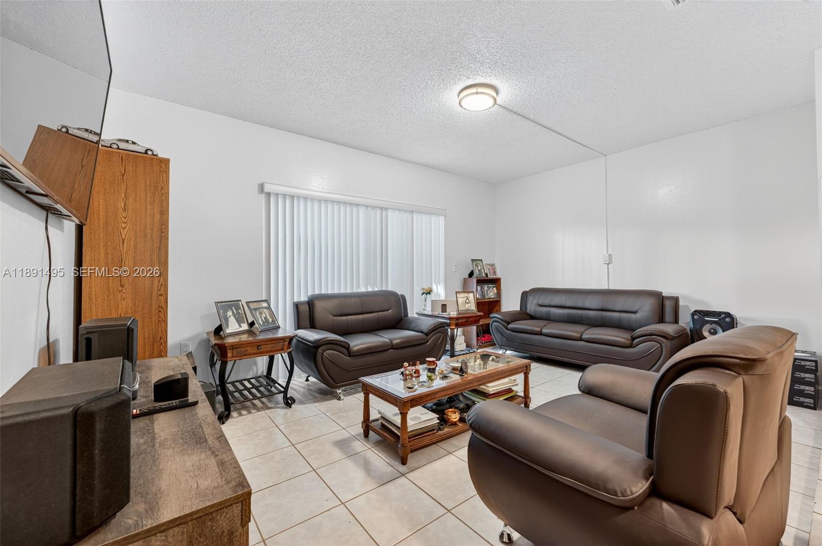 8958 West Sample Road, Unit 8958 Coral Springs, FL 33065 - Photo 8 of 37 a couch and a work place in a room