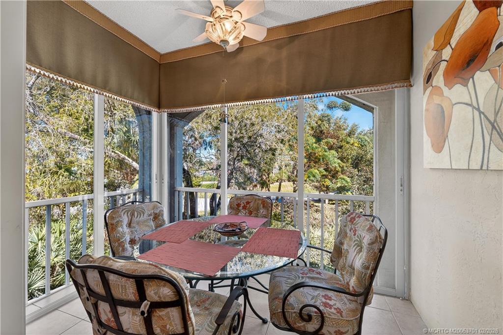 12415 Harbour Ridge Boulevard, Unit 48 Palm City, FL 34990 - Photo 1 of 34 a view of a dining room with furniture window and outside view