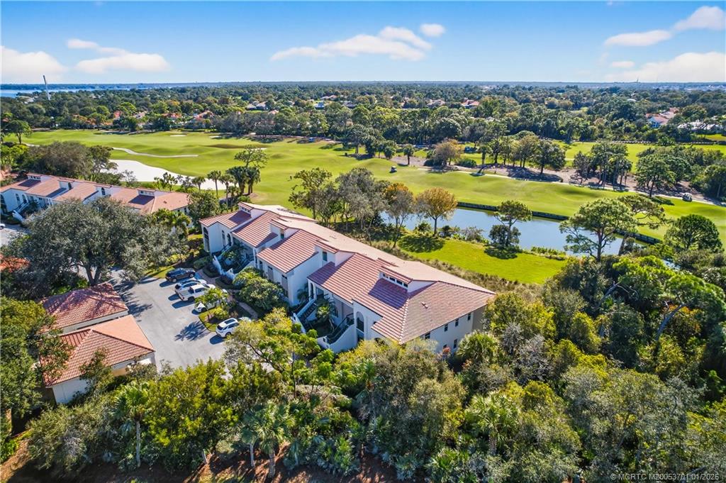 12415 Harbour Ridge Boulevard, Unit 48 Palm City, FL 34990 - Photo 25 of 34 an aerial view of residential houses with outdoor space and river
