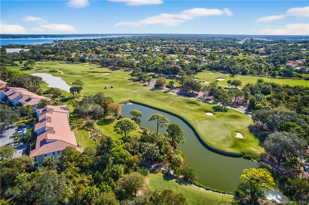 12415 Harbour Ridge Boulevard, Unit 48 Palm City, FL 34990 - Photo 27 of 34 an aerial view of lake residential houses with outdoor space and swimming pool