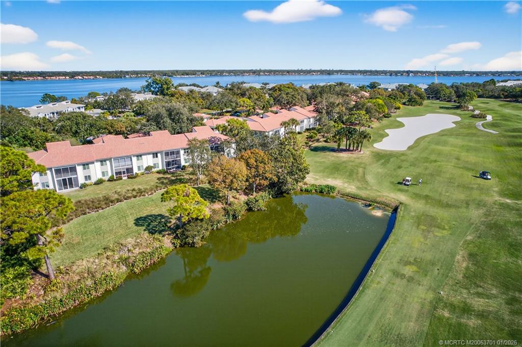 12415 Harbour Ridge Boulevard, Unit 48 Palm City, FL 34990 - Photo 29 of 34 an aerial view of residential houses with outdoor space