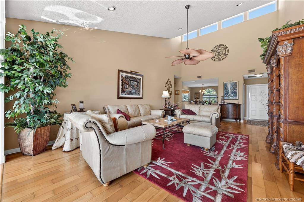 12415 Harbour Ridge Boulevard, Unit 48 Palm City, FL 34990 - Photo 7 of 34 a living room with furniture and a potted plant