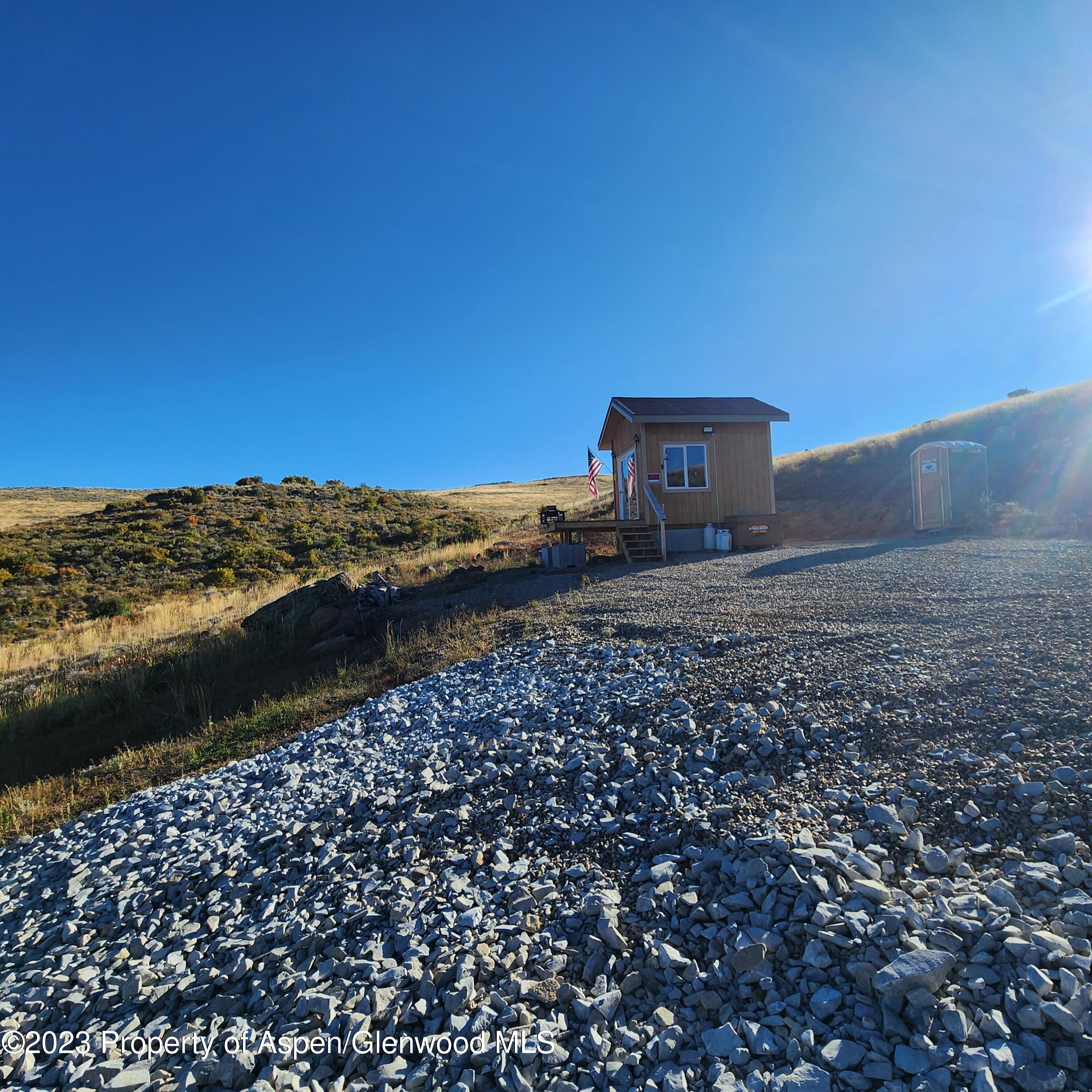 923 Eagle Loop Craig, CO 81625 - Photo 4 of 27 a view of a dry yard with wooden fence
