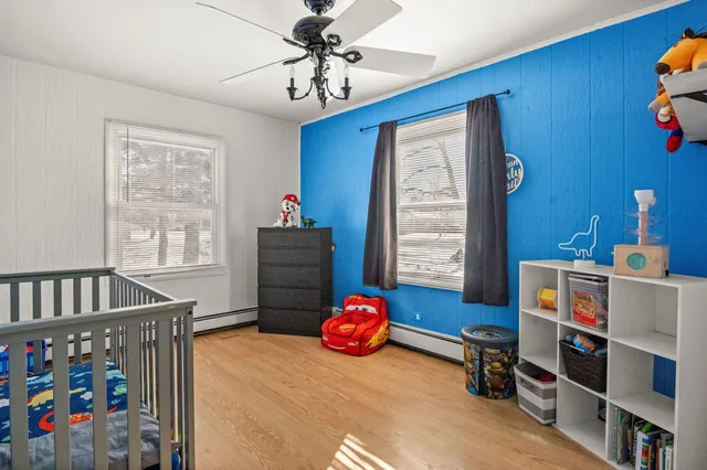 a bedroom with furniture and a window