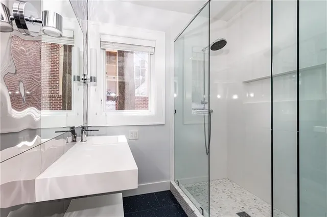 a bathroom with a sink and a mirror