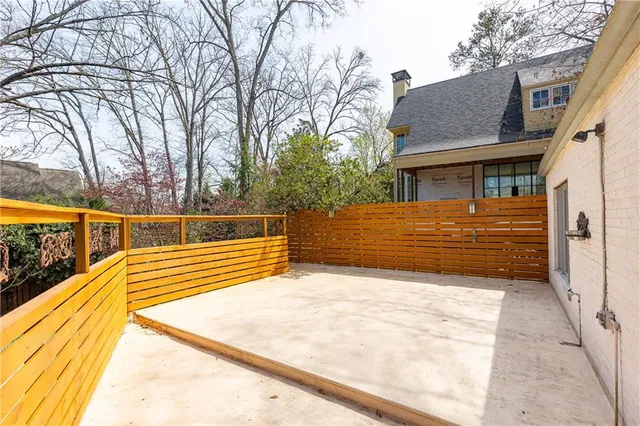 a swimming pool with outdoor seating and yard