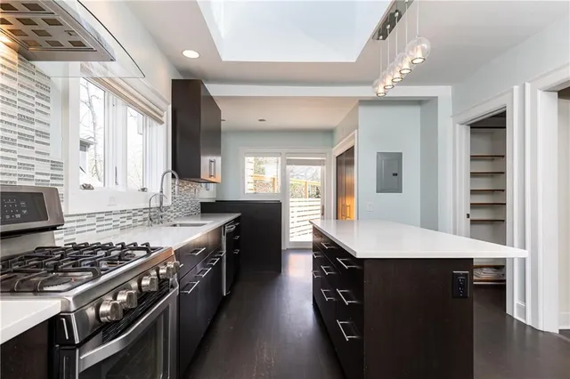 a kitchen with a stove and cabinets