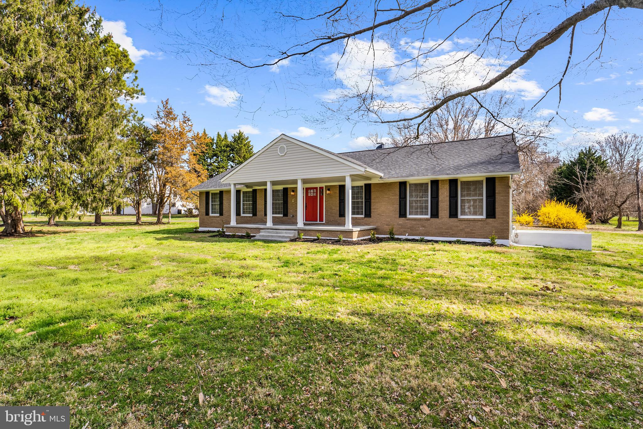 5485 Solomons Island Road Lothian, MD 20711 - Photo 13 of 64 a front view of a house with a big yard