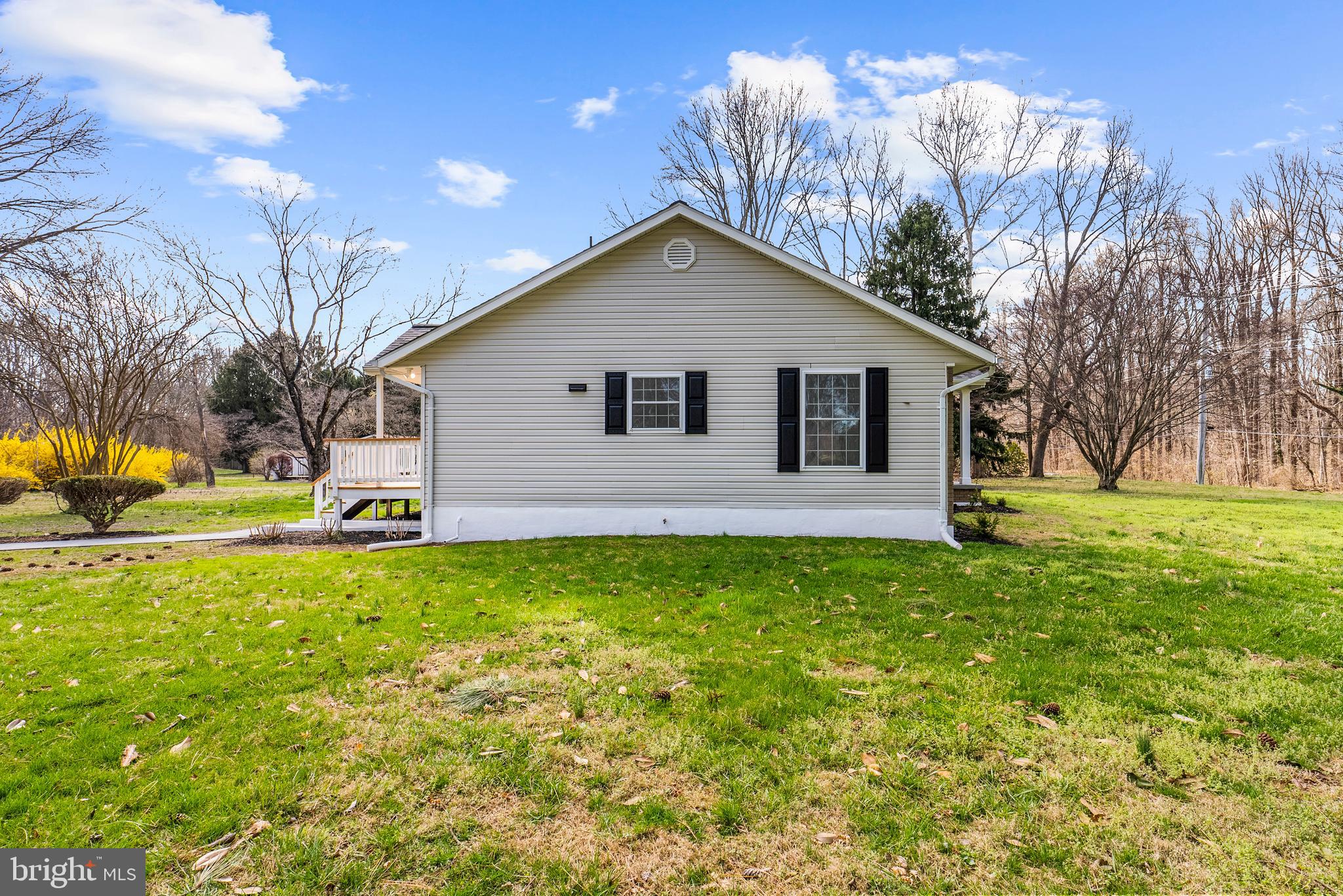 5485 Solomons Island Road Lothian, MD 20711 - Photo 15 of 64 a view of a house with backyard and trees