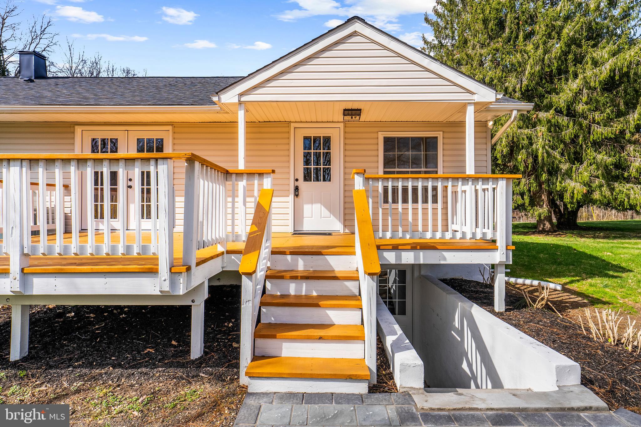 5485 Solomons Island Road Lothian, MD 20711 - Photo 3 of 64 a front view of a house with a yard
