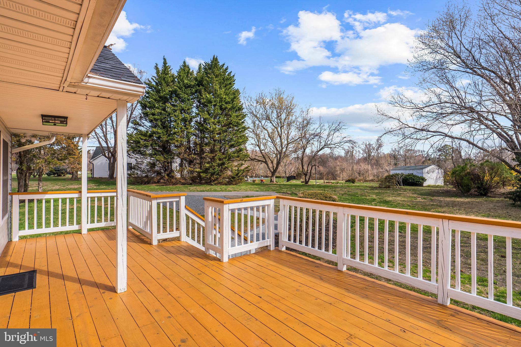 5485 Solomons Island Road Lothian, MD 20711 - Photo 4 of 64 a view of a wooden deck