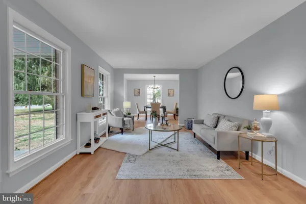 a view of white house with a yard