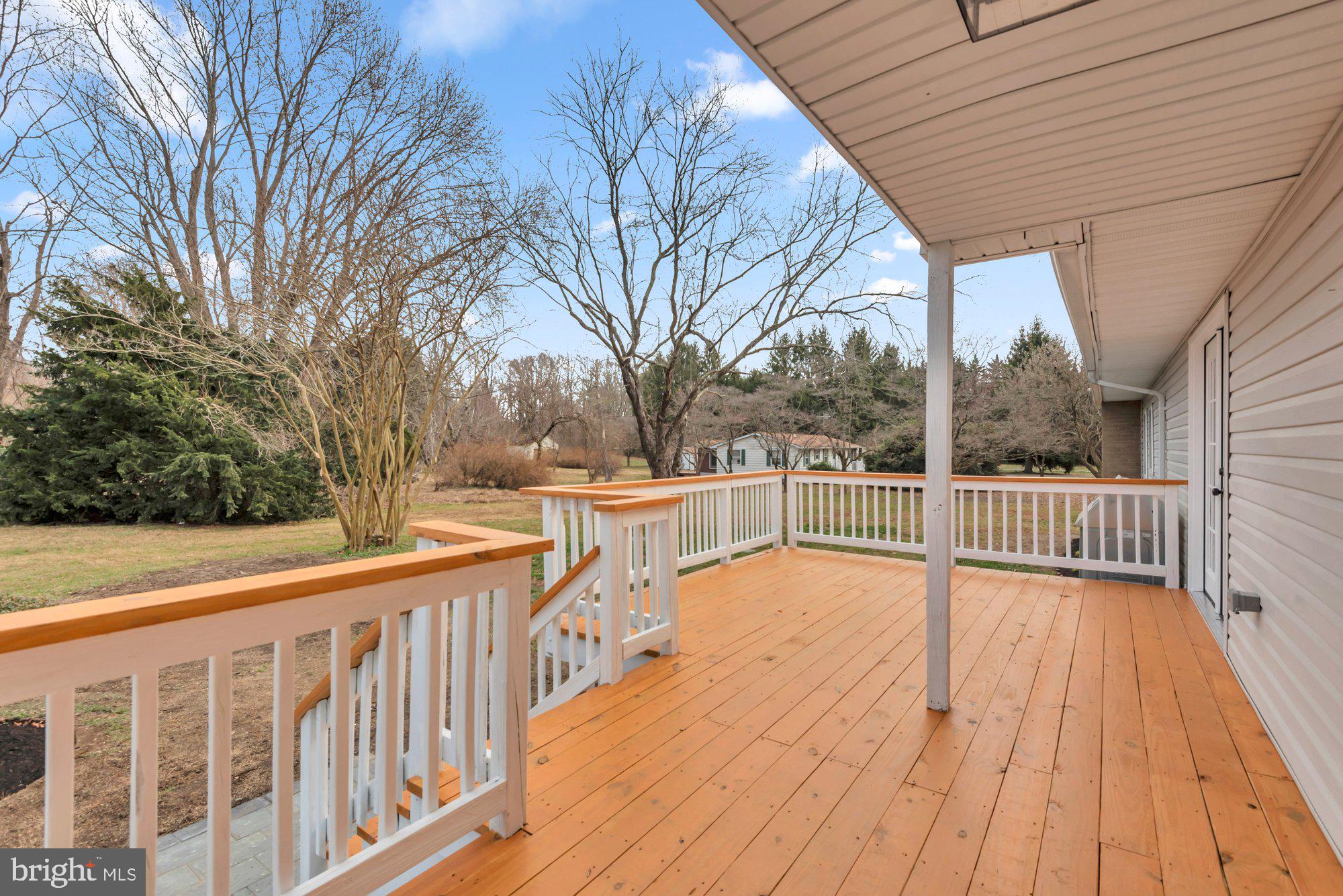 5485 Solomons Island Road Lothian, MD 20711 - Photo 5 of 64 a view of balcony with wooden floor and fence