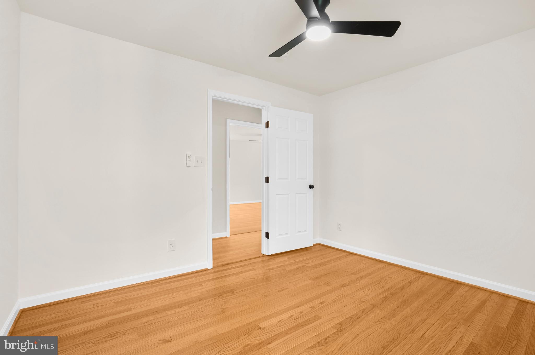 5485 Solomons Island Road Lothian, MD 20711 - Photo 57 of 64 an empty room with an entryway and chandelier fan