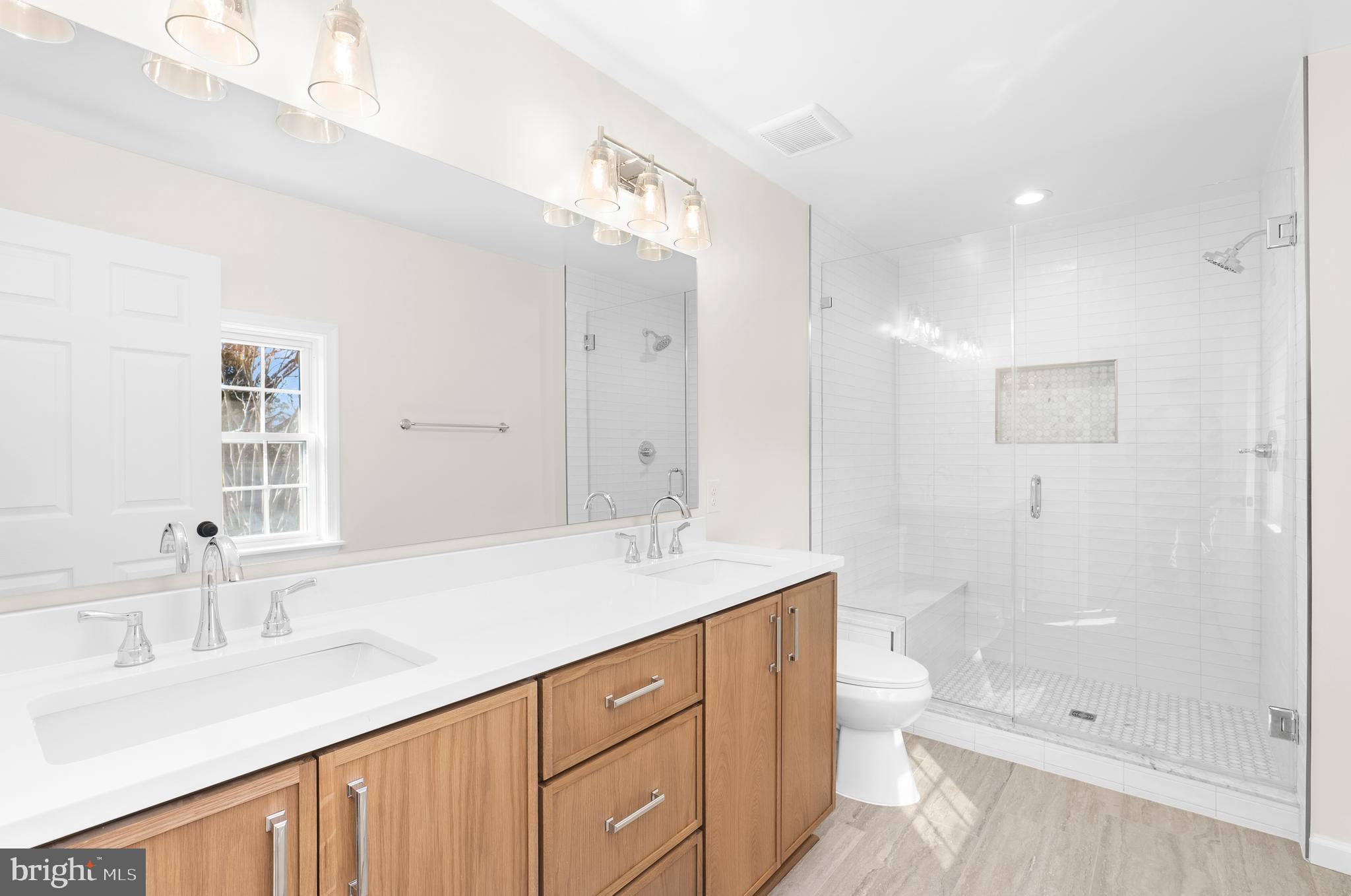 5485 Solomons Island Road Lothian, MD 20711 - Photo 58 of 64 a bathroom with a sink a toilet and shower