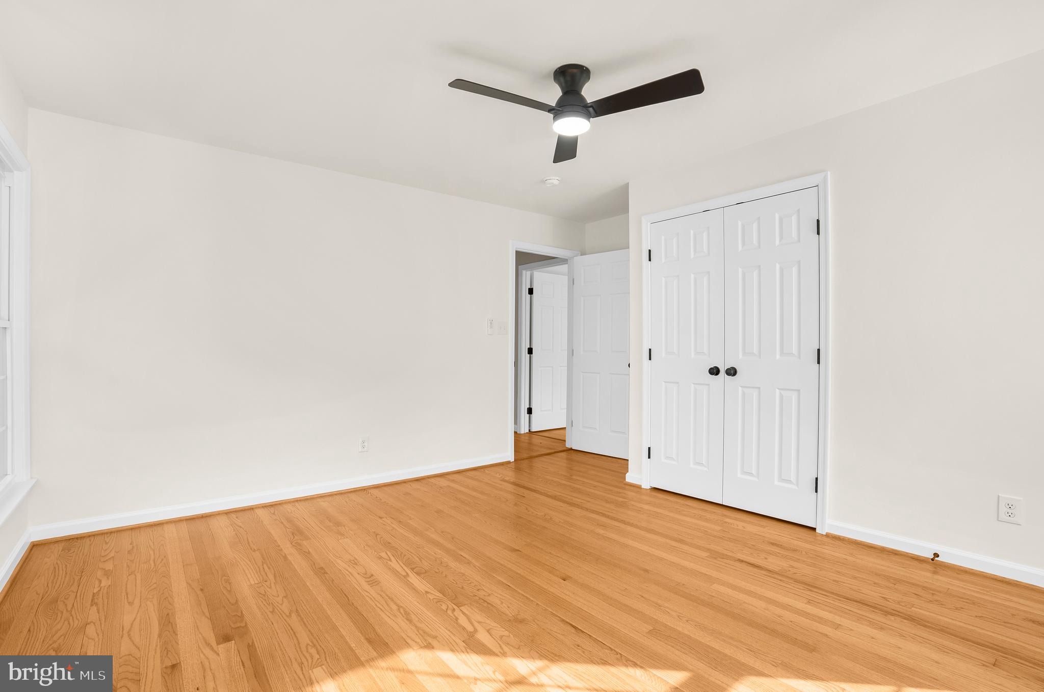 5485 Solomons Island Road Lothian, MD 20711 - Photo 61 of 64 a view of empty room with wooden floor