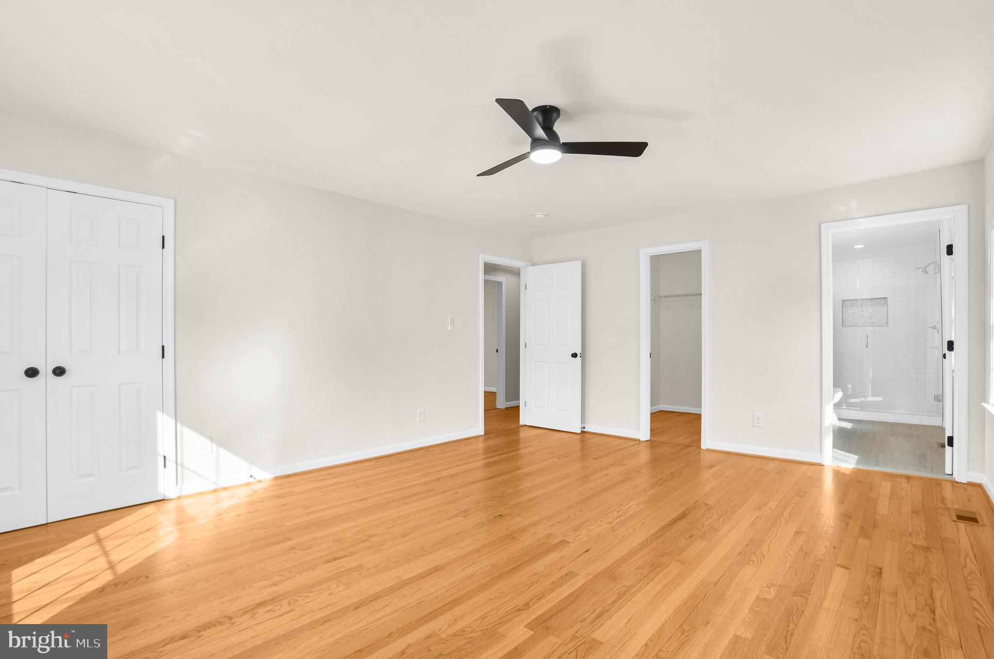 5485 Solomons Island Road Lothian, MD 20711 - Photo 62 of 64 a view of an empty room and wooden floor