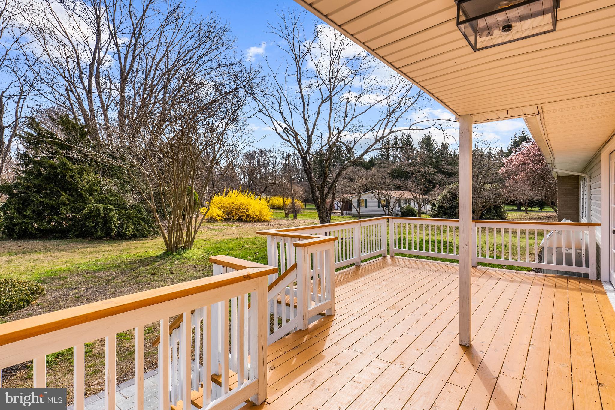 5485 Solomons Island Road Lothian, MD 20711 - Photo 7 of 64 a view of a deck with a yard and furniture