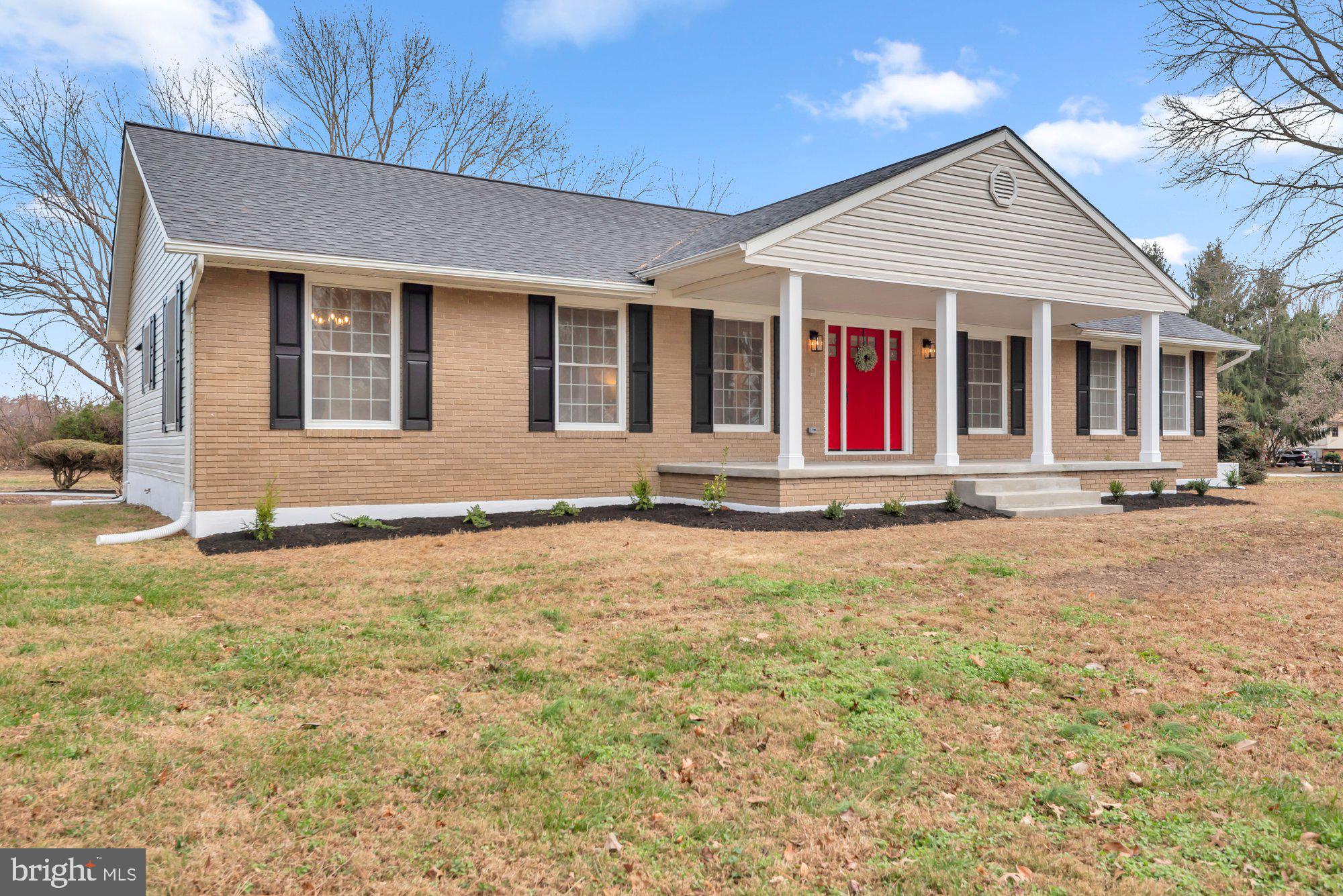 5485 Solomons Island Road Lothian, MD 20711 - Photo 10 of 64 a front view of a house with a yard