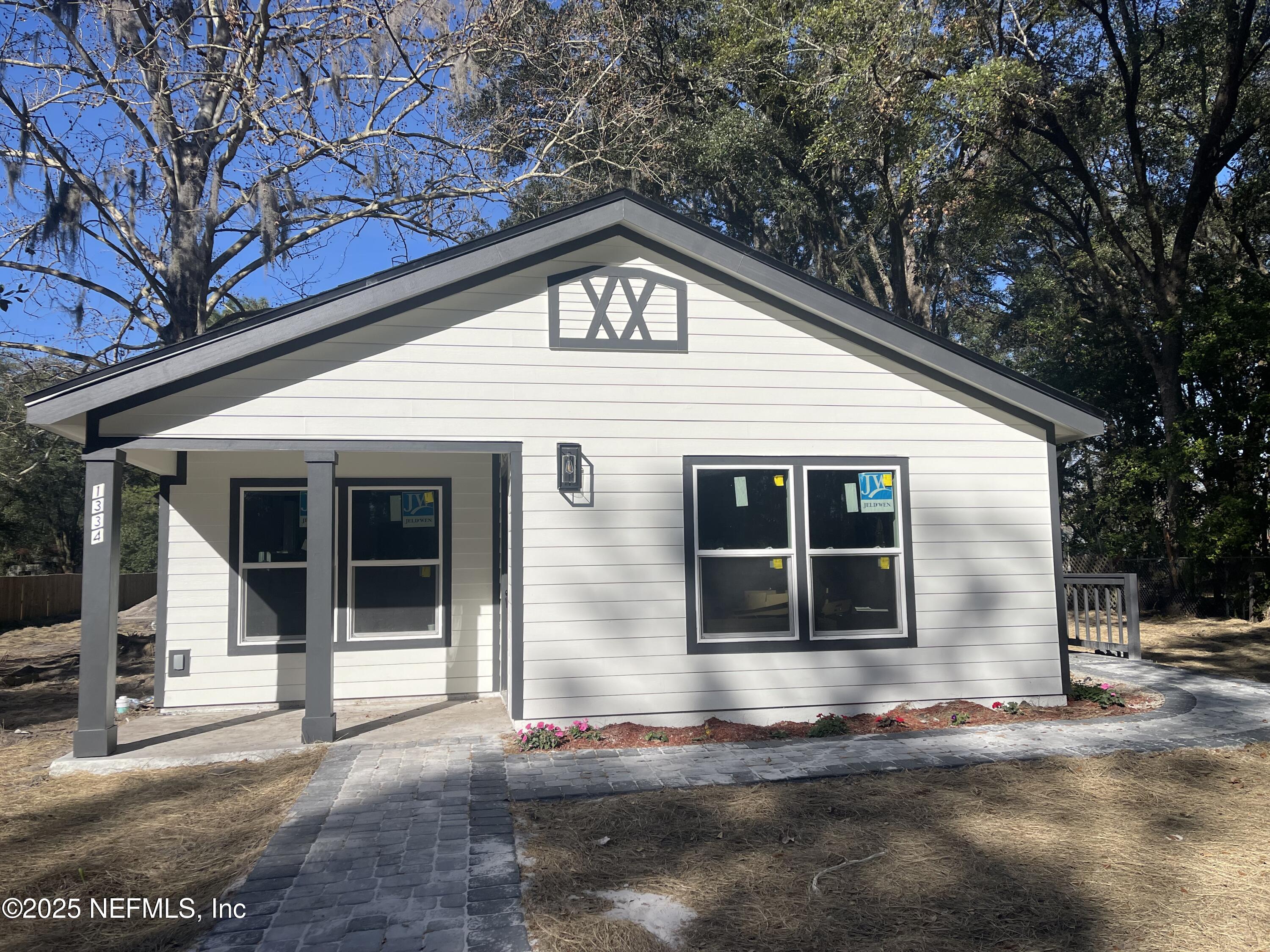 a front view of a house with garage
