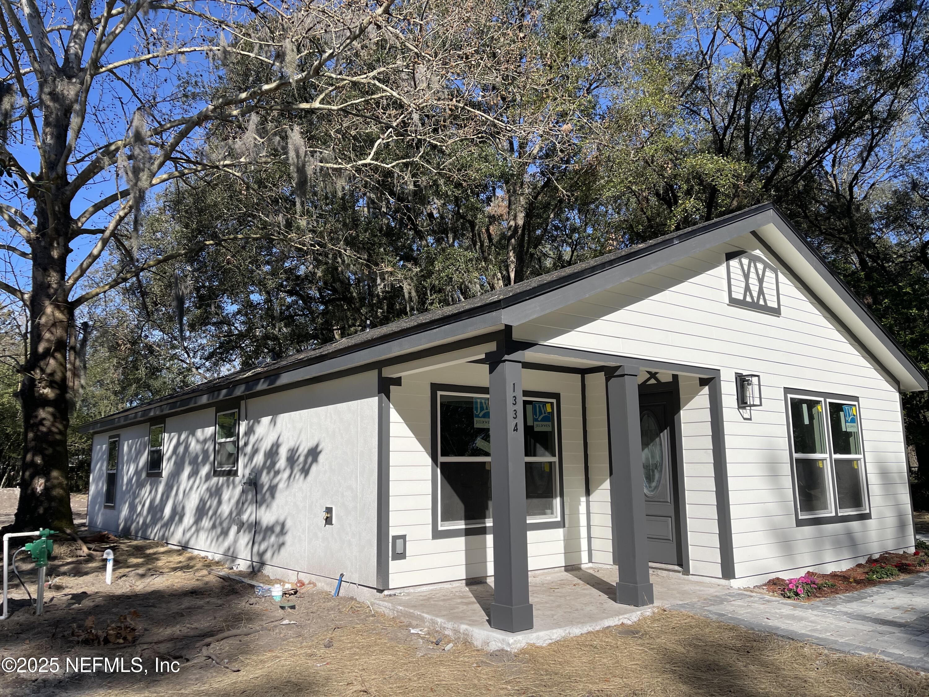 1334 Millson Road Jacksonville, FL 32221 - Photo 3 of 6 a front view of a house with garden