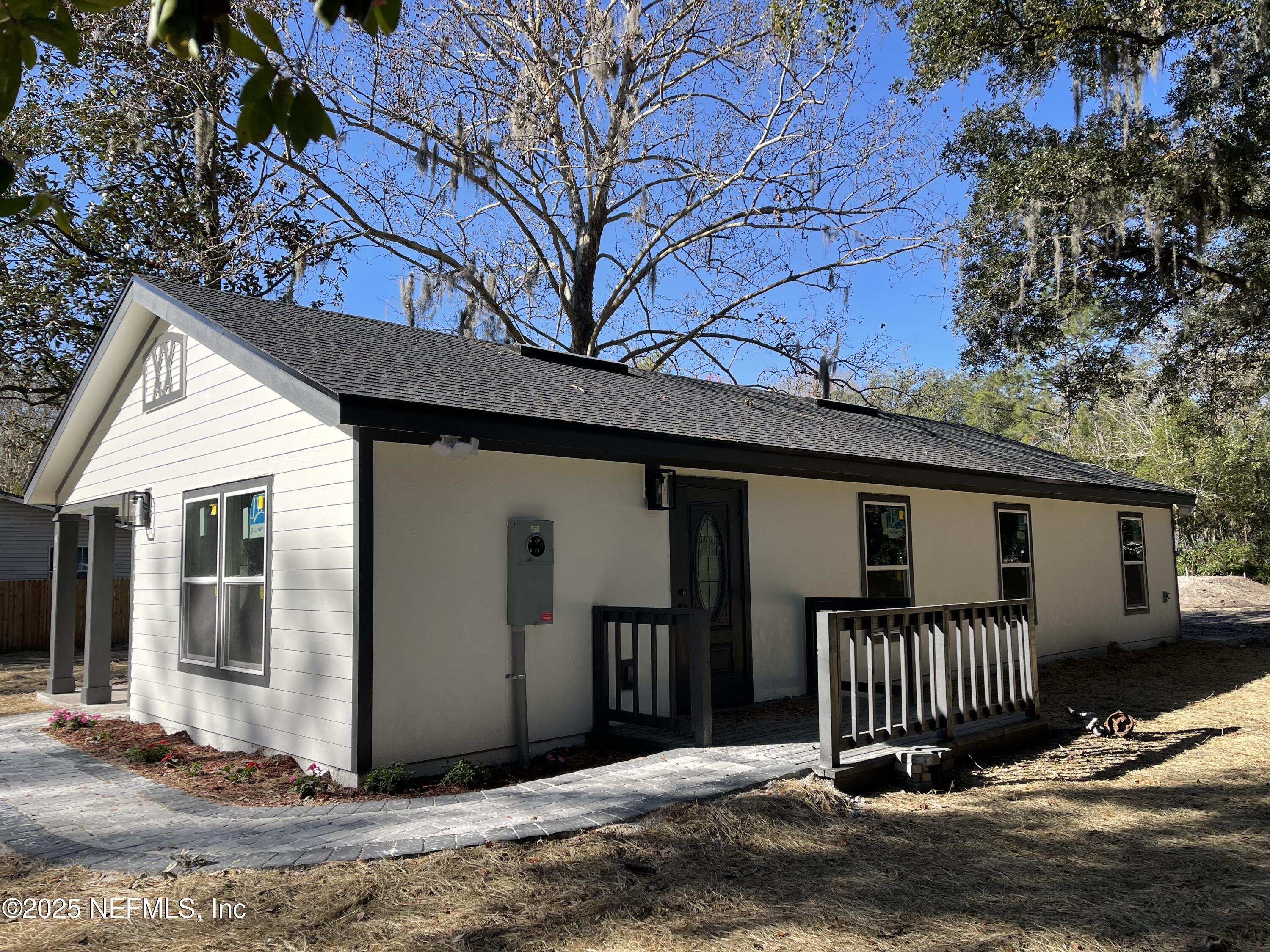 1334 Millson Road Jacksonville, FL 32221 - Photo 5 of 6 a view of a house with a yard