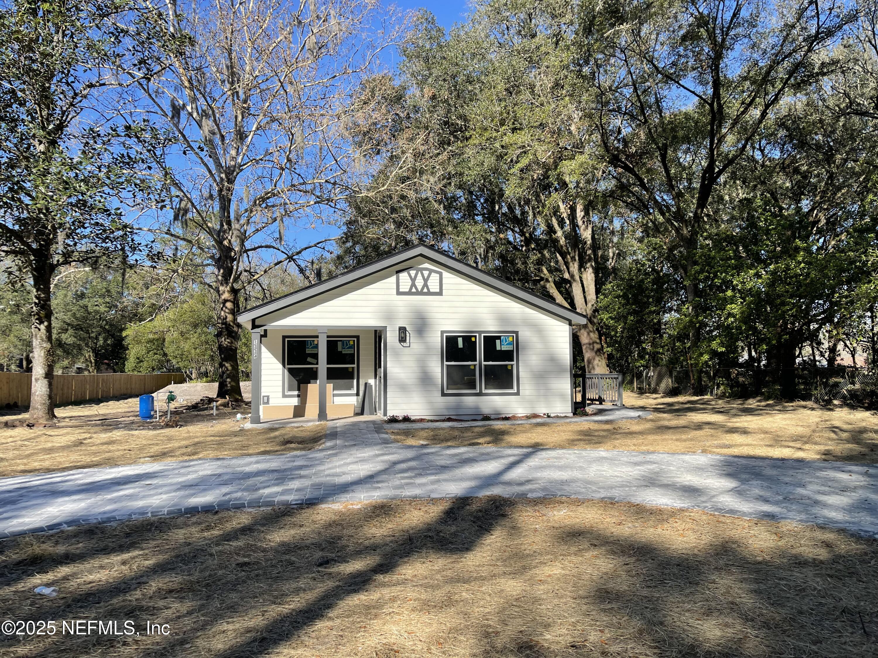 1334 Millson Road Jacksonville, FL 32221 - Photo 6 of 6 a front view of a house with a yard