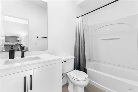 a bathroom with a sink a toilet and a bathtub