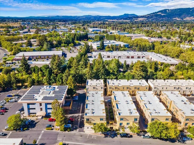 an aerial view of residential houses with outdoor space