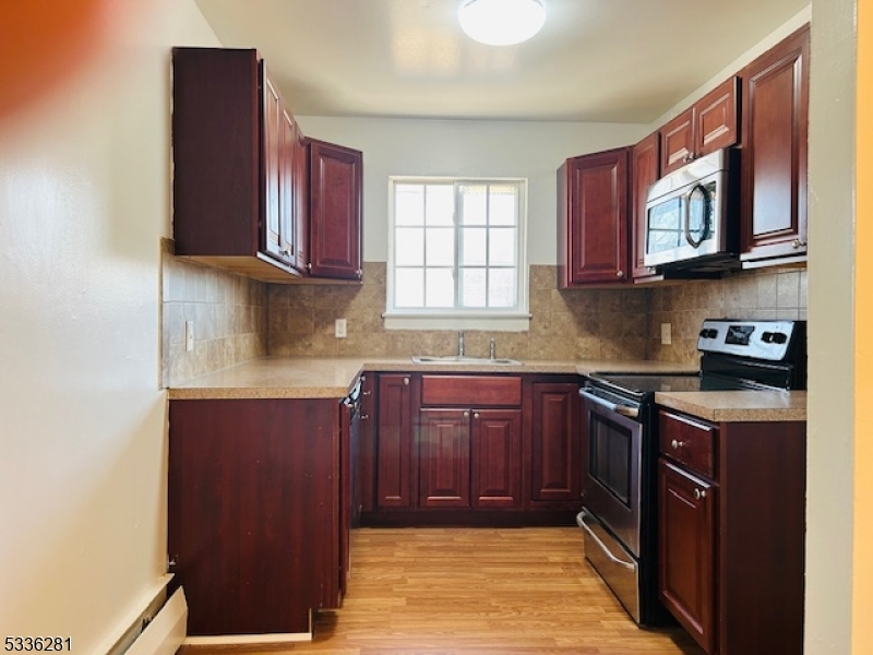 4 Swartswood Road, Unit B Newton, NJ 07860 - Photo 1 of 7 a kitchen with stainless steel appliances granite countertop a sink stove and cabinets