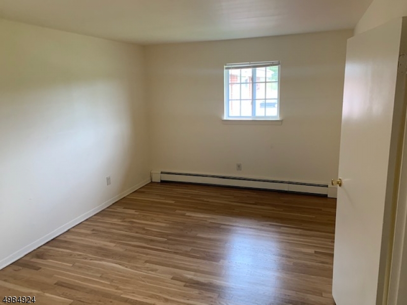 4 Swartswood Road, Unit B Newton, NJ 07860 - Photo 6 of 7 wooden floor in an empty room with a window