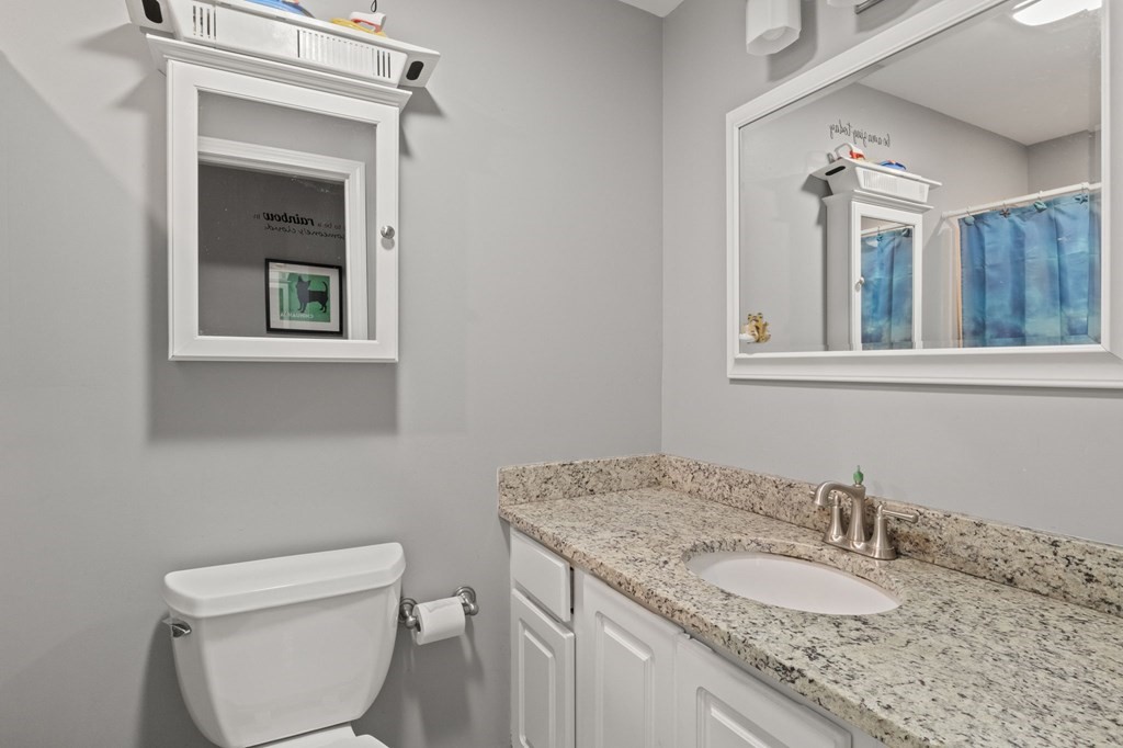 481 Buck Island Road, Unit 11F Yarmouth, MA 02673 - Photo 17 of 28 a bathroom with a granite countertop sink toilet and mirror