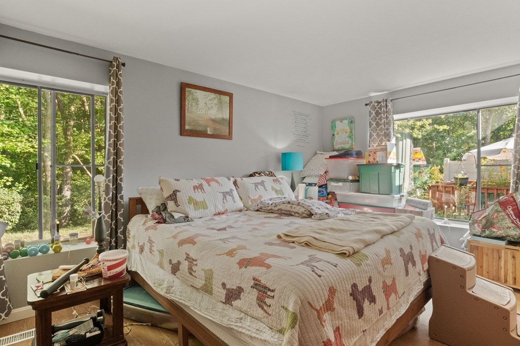 481 Buck Island Road, Unit 11F Yarmouth, MA 02673 - Photo 21 of 28 a bed sitting in a bedroom next to a window