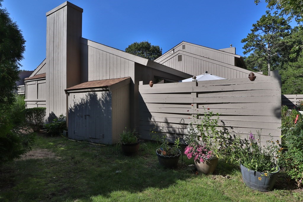 481 Buck Island Road, Unit 11F Yarmouth, MA 02673 - Photo 23 of 28 a view of a house with a yard