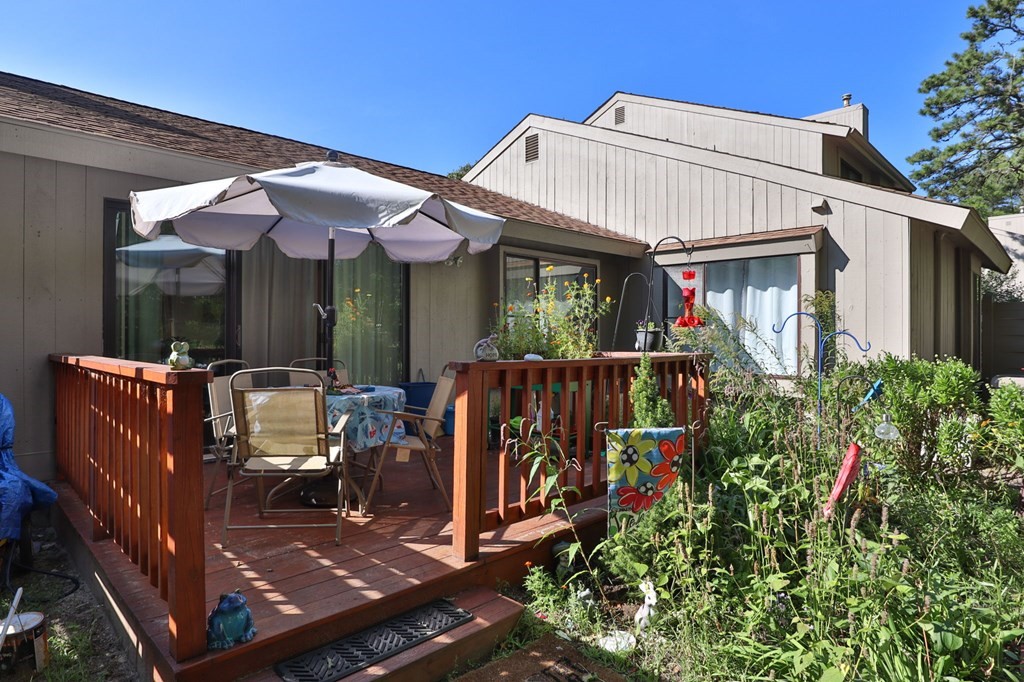 481 Buck Island Road, Unit 11F Yarmouth, MA 02673 - Photo 27 of 28 a view of a dinning table and chairs in patio