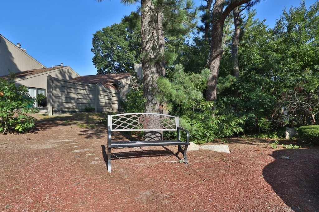 481 Buck Island Road, Unit 11F Yarmouth, MA 02673 - Photo 5 of 28 a park view with a bench