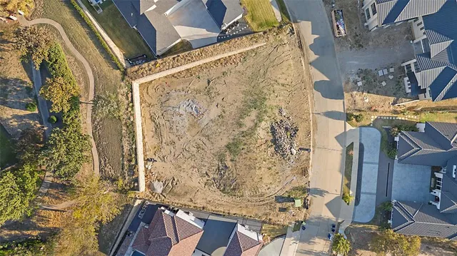 a brick building with a tree in front of it