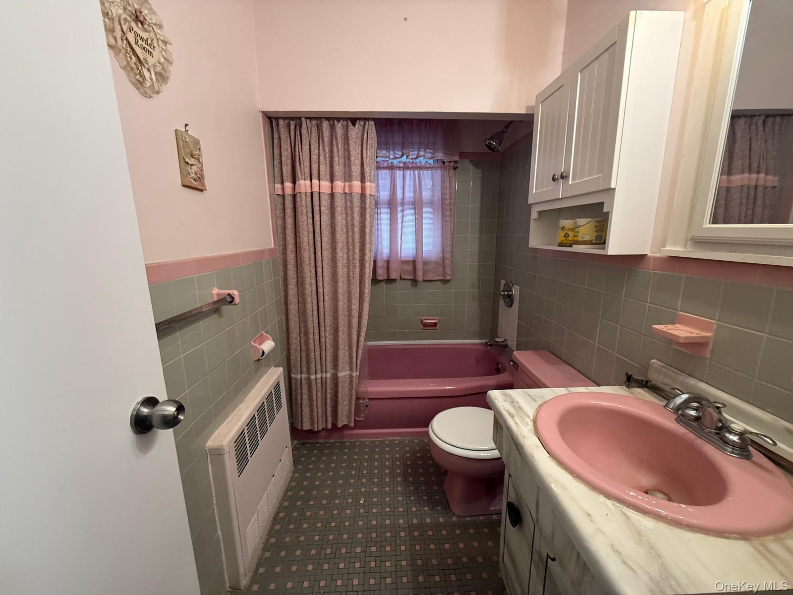 110 Evergreen Avenue, Unit 2 Lynbrook, NY 11563 - Photo 15 of 18 a bathroom with a sink toilet and shower