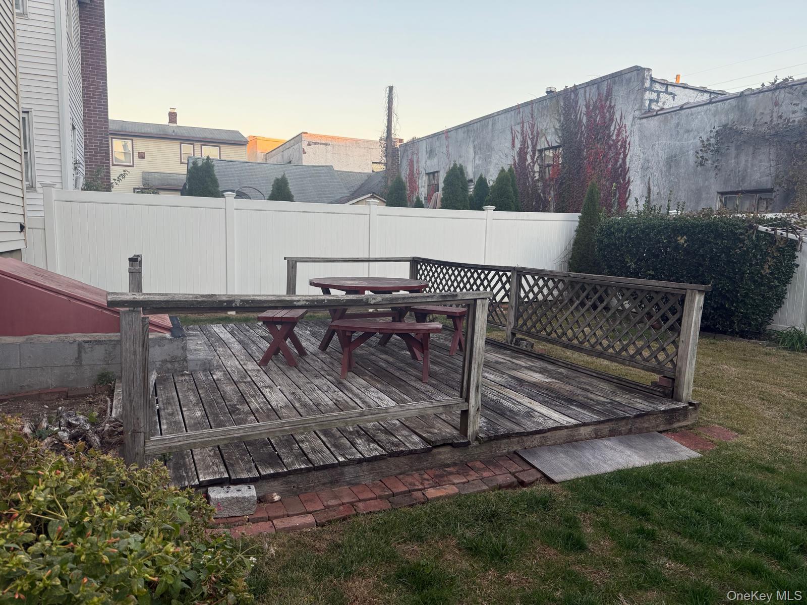 110 Evergreen Avenue, Unit 2 Lynbrook, NY 11563 - Photo 16 of 18 a view of a backyard with sitting area