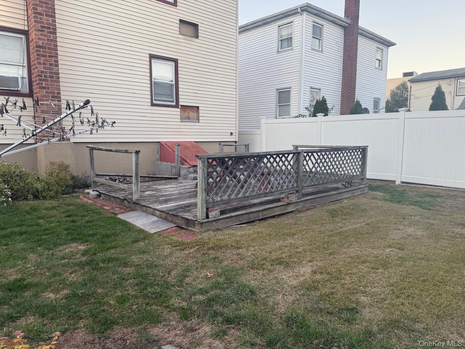 110 Evergreen Avenue, Unit 2 Lynbrook, NY 11563 - Photo 17 of 18 a view of a house with a yard