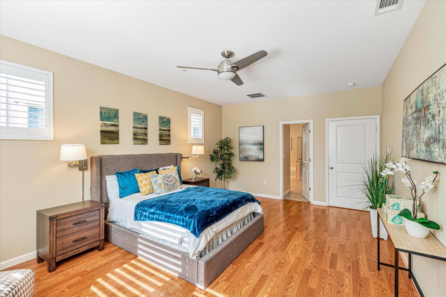 9545 Grande Drive Gilroy, CA 95020 - Photo 17 of 28 a spacious bedroom with a bed and wooden floor