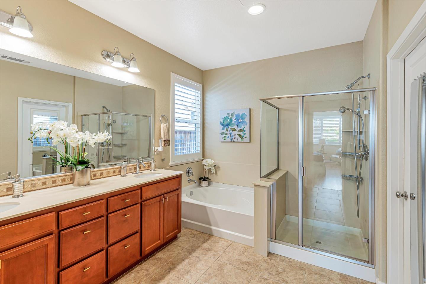 9545 Grande Drive Gilroy, CA 95020 - Photo 18 of 28 a spacious bathroom with a shower sink mirror and