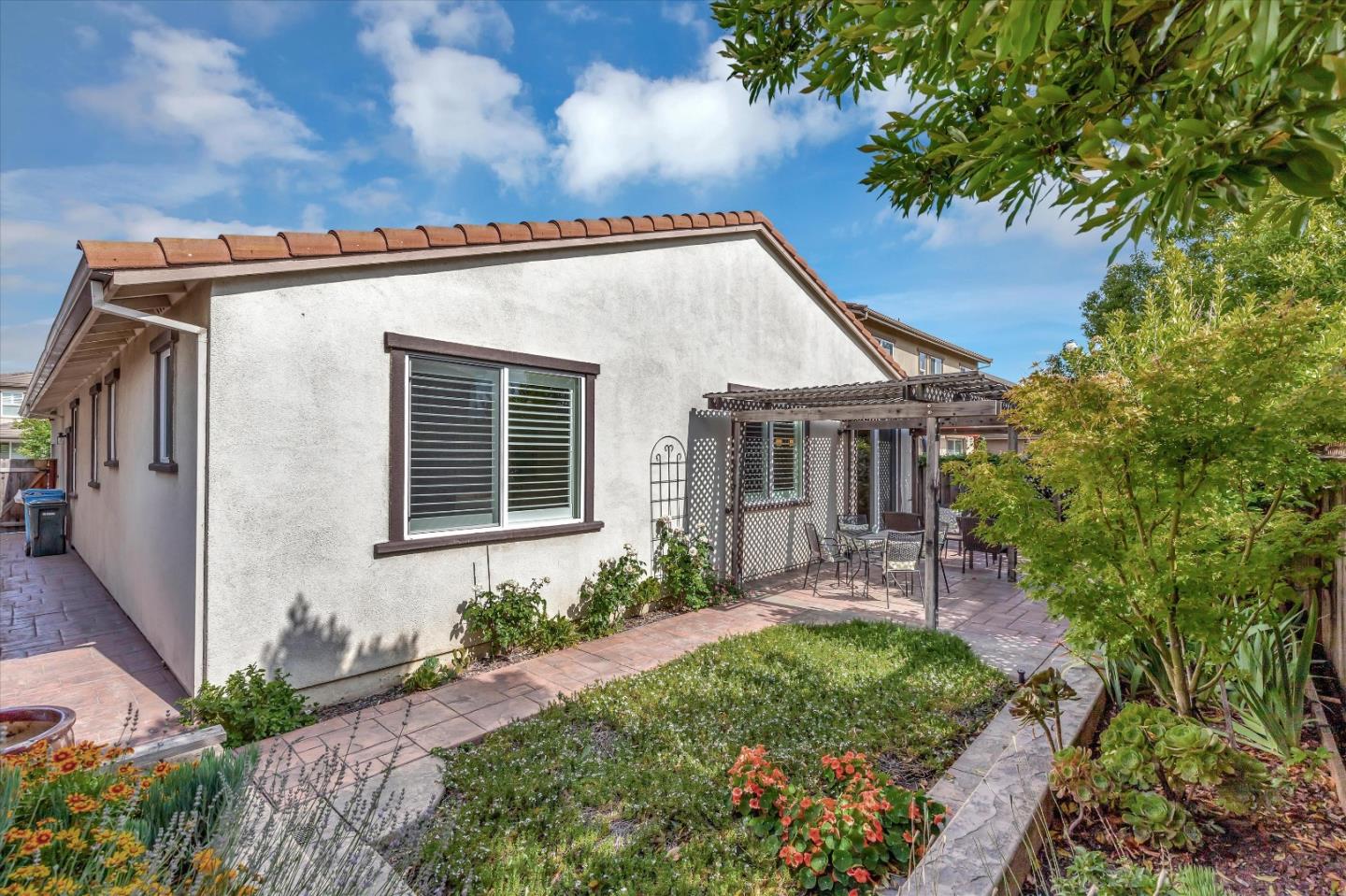 9545 Grande Drive Gilroy, CA 95020 - Photo 24 of 28 a front view of a house with garden