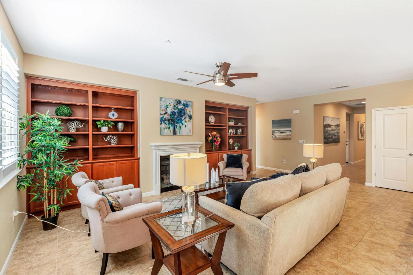 9545 Grande Drive Gilroy, CA 95020 - Photo 4 of 28 a living room with furniture a lamp and a potted plant