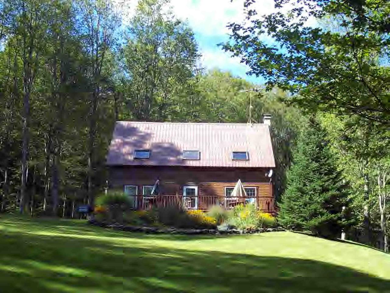 112 Bailey Road Lanesborough, MA 01237 - Photo 1 of 6 a view of a brick house with a yard