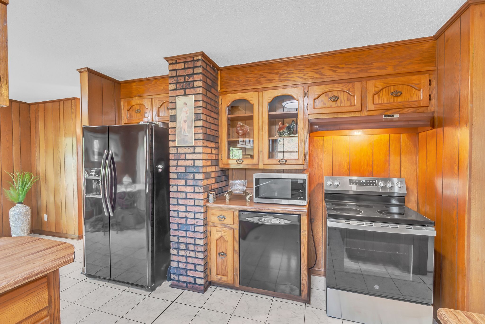 104 Glendale Road Loretto, TN 38469 - Photo 11 of 45 a kitchen with stainless steel appliances granite countertop a refrigerator and a stove